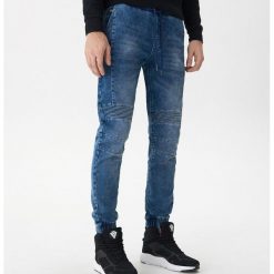 Denimowe joggery - Niebieski. Niebieskie spodnie męskie House, m, bez wzorów, z jeansu. Za 99,99 zł.