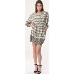 Kremowa Sukienka Overstuff. Białe sukienki damskie Born2be, na co dzień, s, bez wzorów, bez kołnierzyka, bez rękawów, mini. Za 39,99 zł.