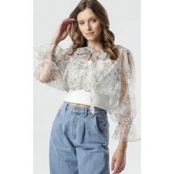 Biała Bluzka Anniyah. Białe bluzki damskie Born2be, s, w kwiaty, z tkaniny, boho, z falbankami, z długim rękawem. Za 109,99 zł.