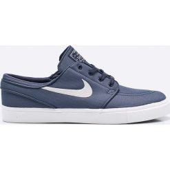 Nike Sportswear - Buty Zoom SB Stefan Janoski Cnvs. Szare buty sportowe męskie marki Nike Sportswear, z gumy, na sznurówki. W wyprzedaży za 319,90 zł.