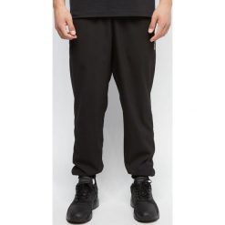 Spodnie męskie dresowe adidas czarne. Czarne spodnie męskie Adidas, s, bez wzorów, z elastanu. Za 139,90 zł.