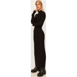 Calvin Klein - Sukienka. Czarne sukienki damskie Calvin Klein, na co dzień, s, bez wzorów, z wełny, casualowe, z okrągłym kołnierzem, z długim rękawem, długie, midi, rozkloszowane. W wyprzedaży za 769,90 zł.