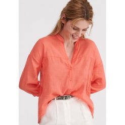 Bawełniana koszula oversize - Pomarańczowy. Pomarańczowe koszule damskie Reserved, bez wzorów, z bawełny, bez kołnierzyka, bez rękawów. Za 49,99 zł.