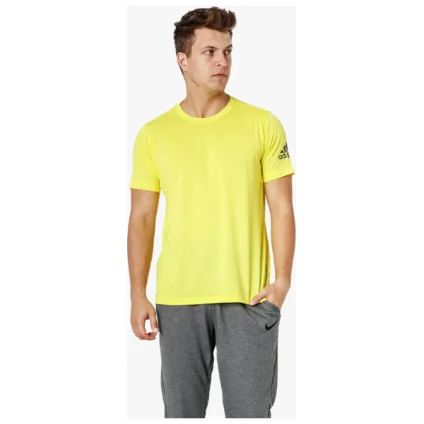 Adidas Koszulka Ss Freelift Prime , żółty, rozmiar XL. Żółte koszulki męskie Adidas, xl, bez wzorów, z poliesteru, bez kołnierzyka, bez rękawów. W wyprzedaży za 79,99 zł.