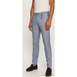 Tommy Hilfiger Tailored - Spodnie. Niebieskie spodnie męskie Tommy Hilfiger Tailored, bez wzorów, z elastanu. Za 579,90 zł.