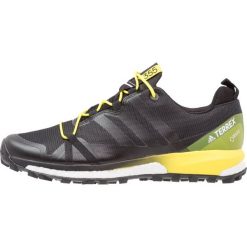 Adidas Performance TERREX AGRAVIC GTX Obuwie hikingowe dark grey/core black/bright yellow. Czarne buty sportowe męskie adidas Performance, z tworzywa sztucznego, outdoorowe. W wyprzedaży za 519,20 zł.