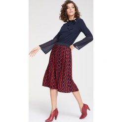 Spódnica w kolorze czarno-czerwonym. Czerwone spódniczki damskie Heine, z nadrukiem, maxi. W wyprzedaży za 129,95 zł.