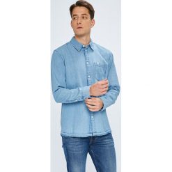 Tommy Jeans - Koszula. Niebieskie koszule męskie Tommy Jeans, m, bez wzorów, z bawełny, klasyczne, z klasycznym kołnierzykiem, z długim rękawem. W wyprzedaży za 219,90 zł.
