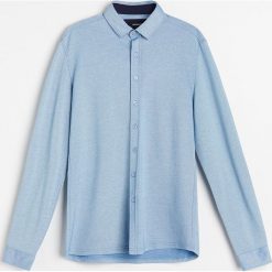 Koszula slim fit z dzianiny pika - Niebieski. Niebieskie koszule męskie Reserved, s, bez wzorów, z dzianiny, bez kołnierzyka, bez rękawów. Za 89,99 zł.