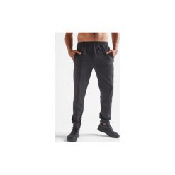 Spodnie dresowe fitness cardio FPA 500 męskie. Czarne spodnie męskie DOMYOS, xl, bez wzorów, z elastanu, sportowe. Za 79,99 zł.