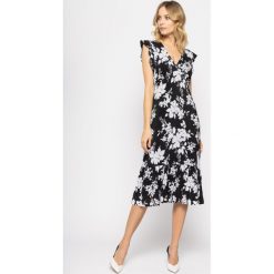Sukienka koktajlowa MICHAEL Michael Kors Ruffled Trimmed Wrap Front MH98ZE5D9G. Czarne sukienki damskie MICHAEL Michael Kors, s, bez wzorów, z elastanu, wizytowe, bez kołnierzyka, bez rękawów. W wyprzedaży za 779,00 zł.