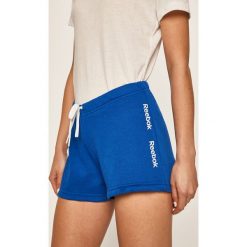 Reebok - Szorty. Niebieskie spodenki sportowe damskie Reebok, s, z nadrukiem, z bawełny, sportowe. Za 69,90 zł.