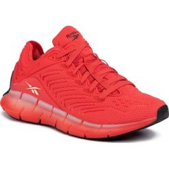 Buty Reebok - Zig Kinetica EH1723 Radred/Sunorg/Black. Czerwone półbuty damskie Reebok, na co dzień, bez wzorów, z tworzywa sztucznego, bez obcasa, bez zapięcia. W wyprzedaży za 309,00 zł.