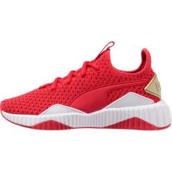 Puma DEFY VARSITY Obuwie treningowe ribbon red/metallic gold. Czerwone buty sportowe damskie marki Puma, z materiału. Za 419,00 zł.