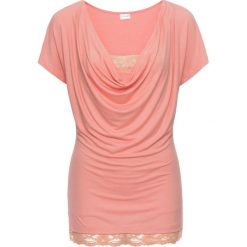 Shirt z koronką bonprix brzoskwiniowy. Pomarańczowe koszulki damskie marki bonprix, w koronkowe wzory, z koronki, bez kołnierzyka, bez rękawów. Za 69,99 zł.