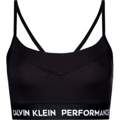 Biustonosz top Calvin Klein Performance Low Impact Sports 00GWS8K114. Czarne topy damskie Calvin Klein Performance, m, bez wzorów, z elastanu, bez kołnierzyka. W wyprzedaży za 119,00 zł.