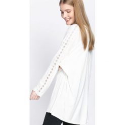 Biała Tunika Sureness. Czarne tuniki damskie marki DOMYOS, z bawełny, street. Za 44,99 zł.