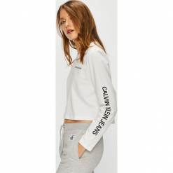 Calvin Klein Jeans - Bluzka. Białe bluzki damskie marki Calvin Klein Jeans, s, z nadrukiem, z bawełny, z okrągłym kołnierzem, bez rękawów. Za 229,90 zł.