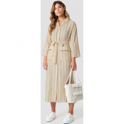MANGO Sukienka Candela Midi - Beige. Szare sukienki na komunię marki Mango, na co dzień, l, z tkaniny, casualowe, z dekoltem halter, na ramiączkach, midi, rozkloszowane. Za 283,95 zł.