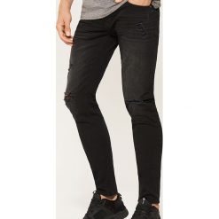 Spodnie męskie: Jeansy slim fit z dziurami - Czarny