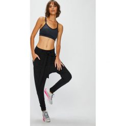 Reebok - Spodnie. Czarne spodnie sportowe damskie marki Reebok, s, z elastanu. Za 269,90 zł.