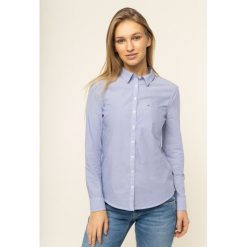 Koszula Tommy Jeans Regular Stripe Poplin DW0DW07651. Niebieskie bluzki damskie Tommy Jeans, m, bez wzorów, z bawełny, bez kołnierzyka, bez rękawów. W wyprzedaży za 239,00 zł.