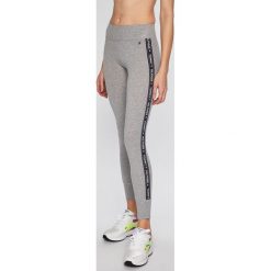 Tommy Hilfiger - Legginsy. Niebieskie spodnie damskie TOMMY HILFIGER, s, z elastanu. Za 229,90 zł.