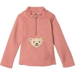 Bluza w kolorze łososiowym. Różowe bluzy niemowlęce Steiff, z aplikacjami, bez rękawów, bez kaptura. W wyprzedaży za 58,95 zł.