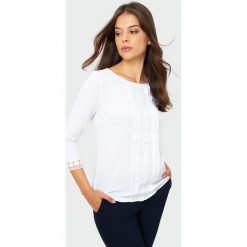 Elegancka bluzka z ozdobną mereżką. Bluzki damskie Greenpoint, bez wzorów, z poliesteru, eleganckie, bez kołnierzyka, bez rękawów. Za 49,99 zł.