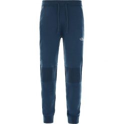 Spodnie dresowe The North Face Active Trail E-Knit T948TZN4L. Niebieskie spodnie męskie The North Face, m, bez wzorów, z dresówki. Za 734,99 zł.