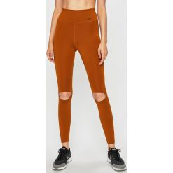 Nike - Legginsy. Żółte spodnie damskie Nike, s, z elastanu. W wyprzedaży za 129,90 zł.