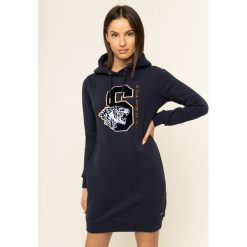 Sukienka dzianinowa Superdry Hilary Sport W8000049A. Niebieskie sukienki damskie Superdry, bez wzorów, z bawełny, sportowe, bez kołnierzyka, bez rękawów, sportowe. W wyprzedaży za 299,00 zł.
