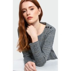 Elegancka bluzka dzianinowa. Bluzki damskie Greenpoint, bez wzorów, z elastanu, eleganckie, bez kołnierzyka, bez rękawów. Za 79,99 zł.