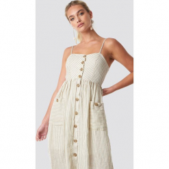 MANGO Sukienka Emilia - Beige. Szare sukienki z falbanami marki Mango, na co dzień, l, z tkaniny, casualowe, z dekoltem halter, na ramiączkach, midi, rozkloszowane. Za 202,95 zł.