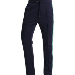Calvin Klein Jeans SIDE STRIPE TRACK PANTS Spodnie treningowe dark blue. Niebieskie jeansy męskie marki Calvin Klein Jeans, z bawełny. Za 549,00 zł.