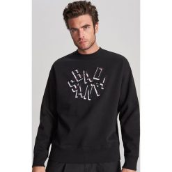 Bluza ze świątecznym napisem - Czarny. Czarne bluzy męskie Reserved, s, z napisami, wizytowe. W wyprzedaży za 29,99 zł.