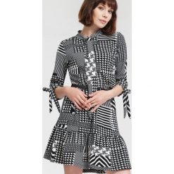 Czarna Sukienka Bad At Love. Sukienki małe czarne damskie marki other, na imprezę, xl, z okrągłym kołnierzem, dopasowane. Za 59,99 zł.