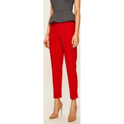 Tommy Hilfiger - Spodnie. Niebieskie spodnie damskie TOMMY HILFIGER, z poliesteru. Za 579,90 zł.