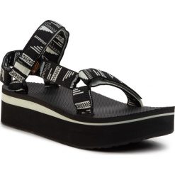 Sandały TEVA - Flatform Universal 1008844 Crblc. Czarne klapki damskie Teva, bez wzorów, z materiału, bez obcasa, na koturnie. W wyprzedaży za 239,00 zł.