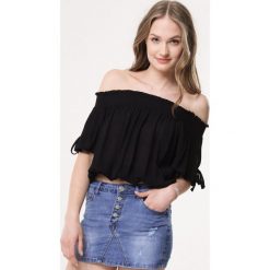Czarna Bluzka Become Enlighten. Czarne bluzki damskie Born2be, s, bez wzorów, bez kołnierzyka, bez rękawów. Za 39,99 zł.