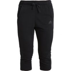 Spodnie dresowe damskie: adidas Performance SOLID Rybaczki sportowe noir