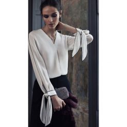 Damska bluza KALIZMA. Bluzki damskie Damska bluza KALIZMA, s, bez wzorów, bez kołnierzyka, bez rękawów. W wyprzedaży za 69,00 zł.