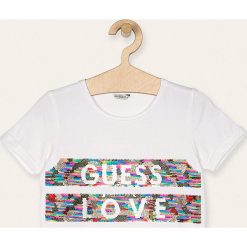 Guess Jeans - T-shirt dziecięcy 118-175 cm. Białe bluzki dziewczęce Guess Jeans, z aplikacjami, z elastanu, z okrągłym kołnierzem, z krótkim rękawem, krótkie, bez kaptura. Za 139,90 zł.