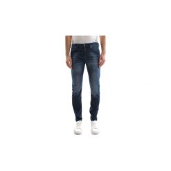 Jeansy slim fit Diesel THOMMER. Niebieskie jeansy męskie Diesel, m, bez wzorów. W wyprzedaży za 401,17 zł.