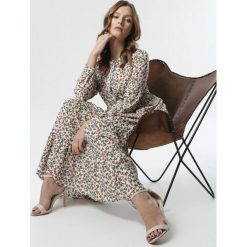 Biała Sukienka Farrington. Białe sukienki damskie Born2be, na co dzień, s, w kwiaty, z okrągłym kołnierzem, z długim rękawem, długie, midi, rozkloszowane. Za 119,99 zł.