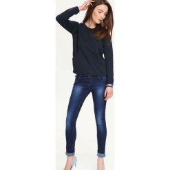 Bluza nierozpinana damska we wzory. Bluzy damskie TROLL, xs, bez wzorów, bez rękawów, bez kaptura. W wyprzedaży za 39,99 zł.