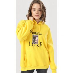 Żółta Bluza Eatheney. Żółte bluzy damskie Born2be, s, bez wzorów, bez rękawów, z kapturem. Za 89,99 zł.
