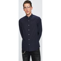Calvin Klein Jeans - Koszula. Niebieskie koszule męskie Calvin Klein Jeans, m, bez wzorów, z elastanu, klasyczne, z klasycznym kołnierzykiem, z długim rękawem. W wyprzedaży za 219,90 zł.