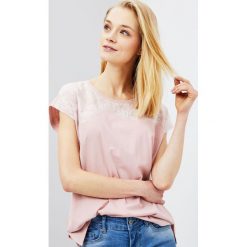 Bluzka oversize. Bluzki damskie Moodo, s, bez wzorów, bez kołnierzyka, bez rękawów. Za 9,99 zł.