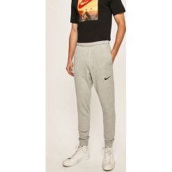 Nike - Spodnie. Szare spodnie męskie Nike, na co dzień, xl, bez wzorów, z poliesteru. Za 169,90 zł.